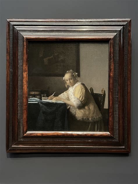 schrijvende vrouw in het geel|Johannes Vermeer